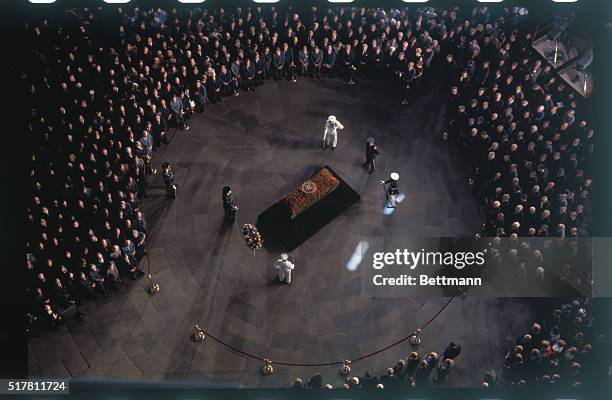 Washington: View from top of Capitol Dome shows rose-covered bier of Senator Everett McKinley Dirksen , as he lies in state in the rotunda.