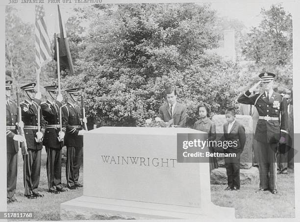 The three children of Philippine President Diosdado Macapagal stand in silent prayer today before the grave of General Jonathan Wainwright in...