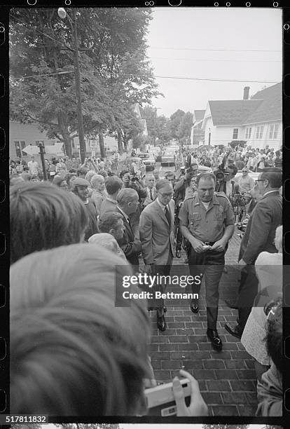 Edgartown, Mass.: Edgartown Police Chief James Arena , and Dukes County Prosecutor Walter Steele make their way through crowds of curious and newsmen...