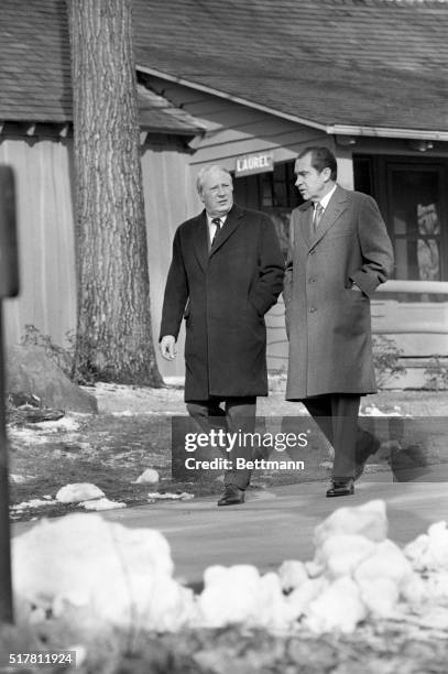 Camp David, Maryland: Snow was on the ground when Pres. Nixon took British Prime Minister Edward Heath for a stroll 12/18 around the Presidential...