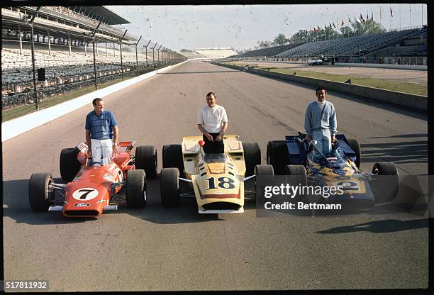 The three front line starters for the 1970 Indianapolis 500 Memorial Day race pose with their cars. They are A.J. Foyt, Johnny Rutherford and Al...