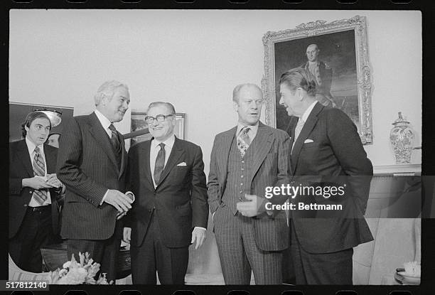 Washington: President Ford chats with Ronald Reagan while Vice President Nelson Rockefeller chats with John Connally at the start of the White House...