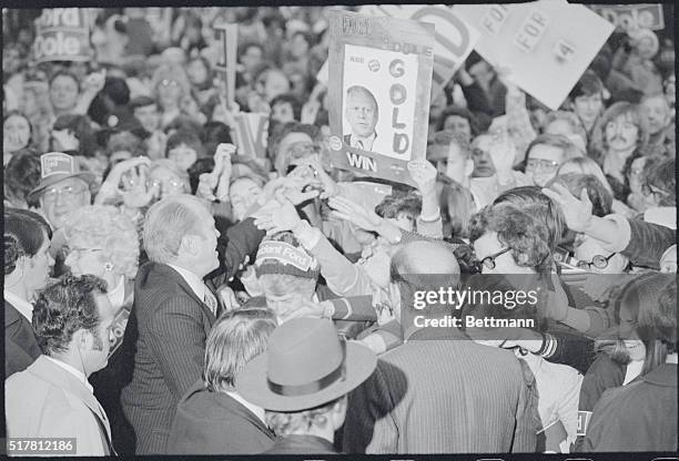 Canton, Ohio: President Gerald Ford goes into the large crowd that greeted him at a rally at the Akron-Canton airport here as he started the last day...