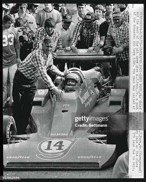 Chief mechanic A.J. Foyt, Sr. And the rest of the pit crew give A.J. Foyt a push into victory lane at the close of the Schaefer 500 here 6/29. The...