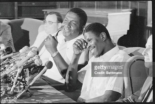 Washington: Future New York Knick Patrick Ewing and Hoyas head basketball coach John Thompson laugh during a press conference. Ewing, the 7-foot...