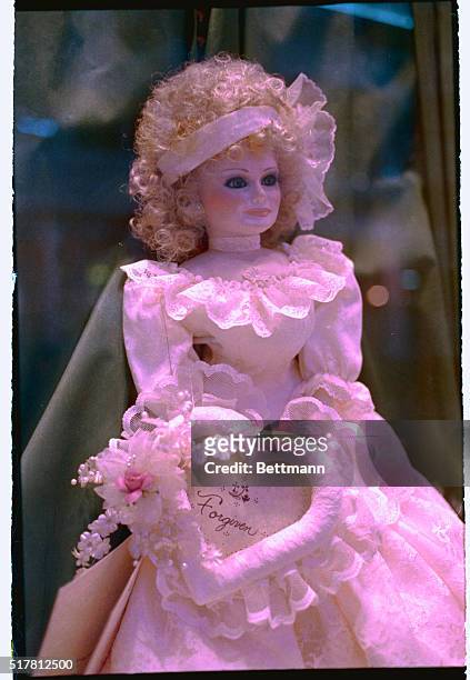 Fort Mill, South Carolina: A toy doll made to resemble Tammy Faye Bakker is adorned with a cloth heart inscribed with the word "forgiven" as it sits...