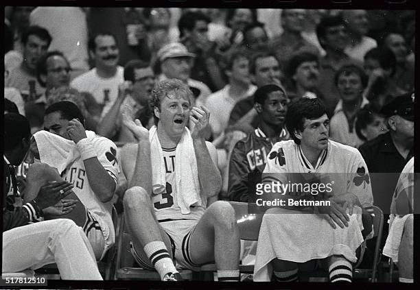 Happy Celtics' star Larry Bird applauds his teammates from the bench in the 4th quarter as the Celtics defeated the Lakers, 148-114 in game 6 of the...