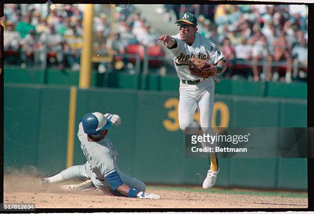 Oakland: Shortstop Walt Weiss, of the high-flying Oakland A's, relays to first for double play in the 8th inning. Toronto's Fred McGriff is out at...