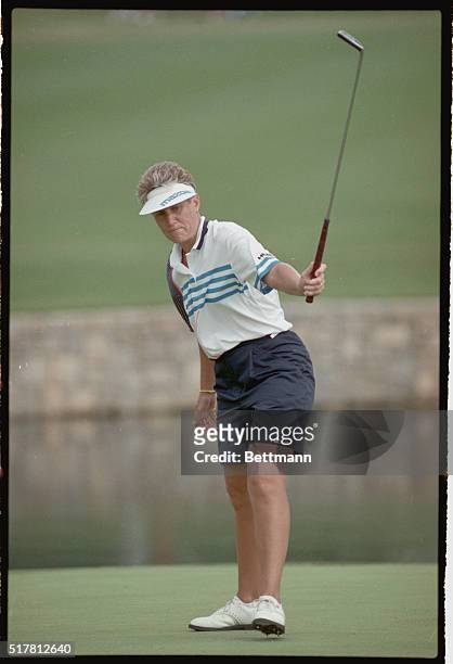Duluth, Georgia: Patty Sheehan, the leading money winner on this year's LPGA tour, urges in a birdie putt on the 18th hole during the opening round...
