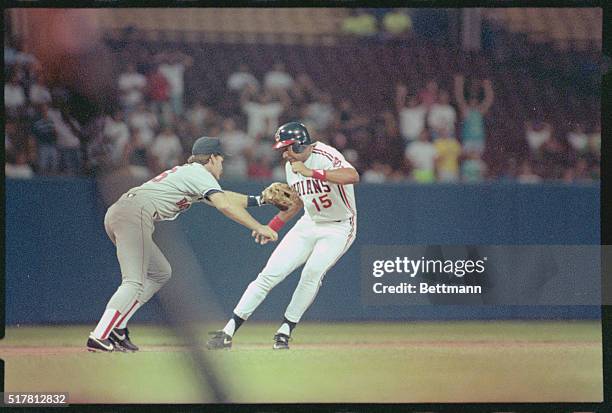 Cleveland, Ohio: Boston 3rd baseman Wade Boggs tags Sandy Alomar of Cleveland in 2nd inning action of game, 8/28. Alomar attempted to advance to 3rd,...