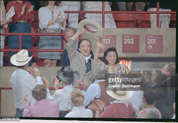 Houston: Japanese Prime Minister Toshiki Kaifu and wife Sachiyo wave to the crowd as they are introduced upon arrival at a Houston rodeo 7/8.