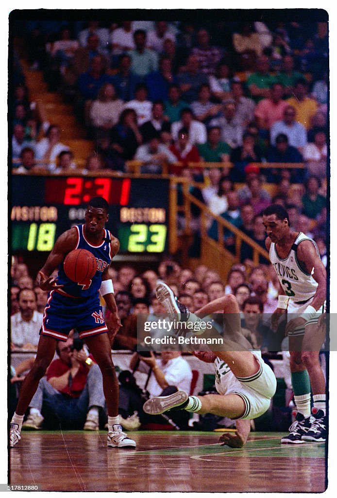 Larry Bird Falling to the Floor During a Game
