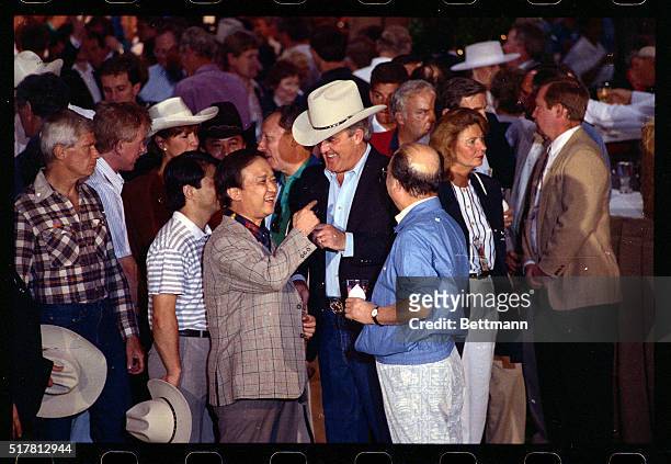 Houston, TX- Japan's Prime Minister Toshiki Kaifu and Canadian Prime Minister Brian Mulroney enjoy a laugh together during a barbecue in Houston 7/8...