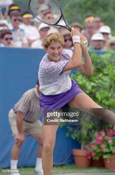 Houston: Bearing down to win, Monica Seles, Sarasota, FL, smashes a return in winning the Virginia Slims of Huston against Mary Joe Fernandez, of...