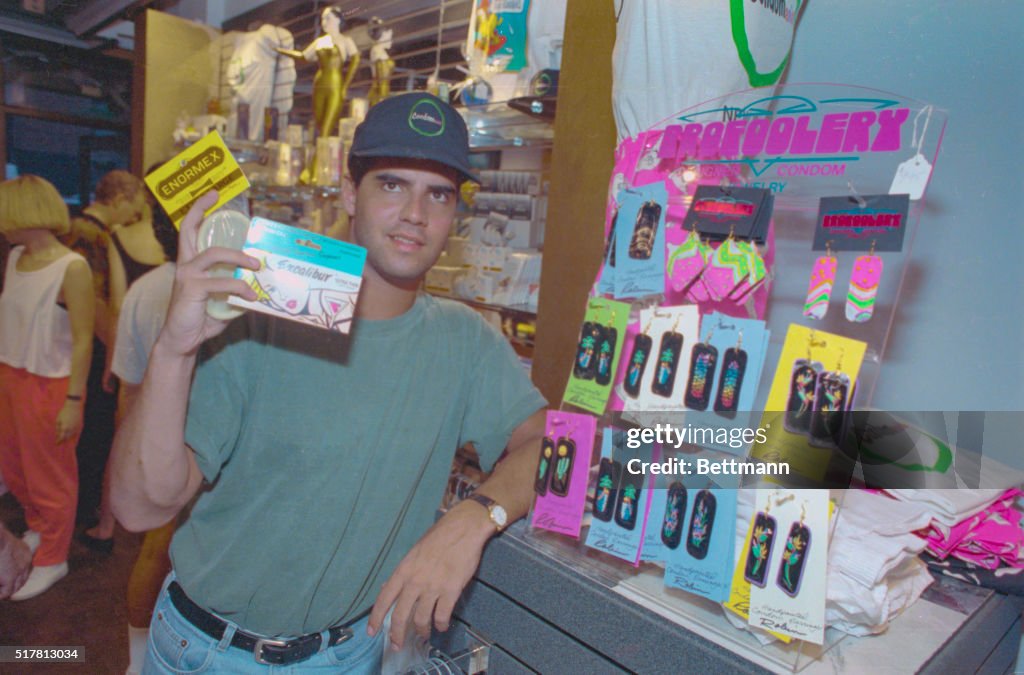 Store Owner Holding Condom Box