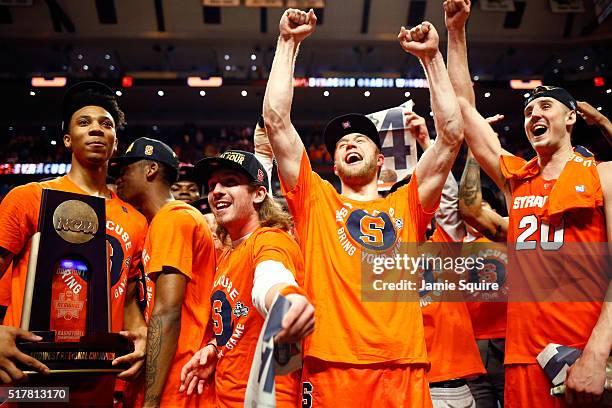 Trevor Cooney of the Syracuse Orange celebrates their 68 to 62 win over the Virginia Cavaliers with teammates during the 2016 NCAA Men's Basketball...