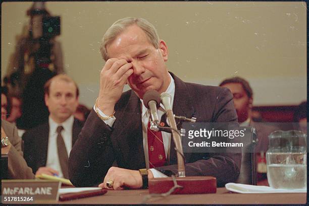 Washington: Former national security adviser Robert McFarlane ponders a question during the final day of his testimony at the Iran-Contra hearings...