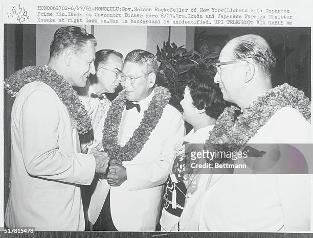 Honolulu, Hawaii: Governor Nelson Rockefeller of New York chats with Japanese Prime Minister Hayoto Ikeda at the governors dinner. Mrs. Ikeda and...