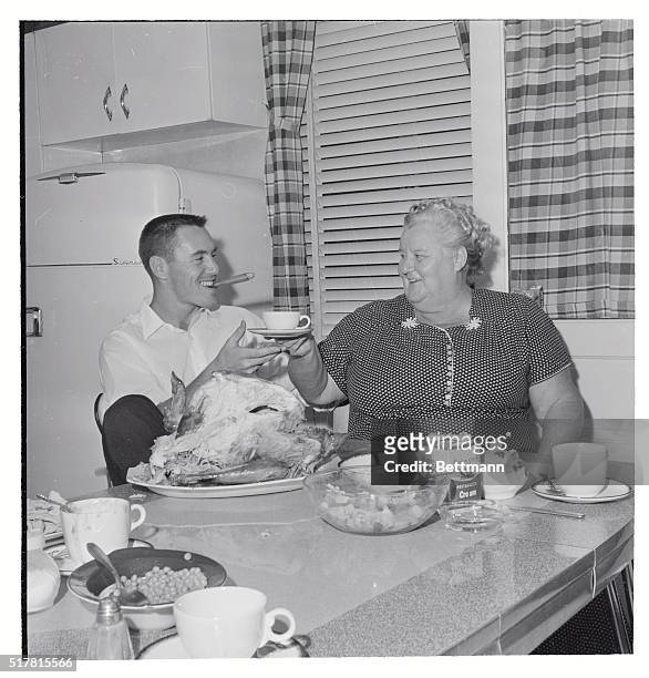 Pittsburgh: A big cigar and some of his mother's coffee after a big meal finish a 'perfect day' for Pirate second baseman Bill Mazeroski at a family...