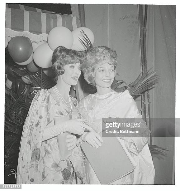 Lovelies at the "Emmy's". Hollywood: Lovely Loretta Young with her look-alike daughter, Mrs. Joe Tinney are shown as they attended the "Emmy" awards...