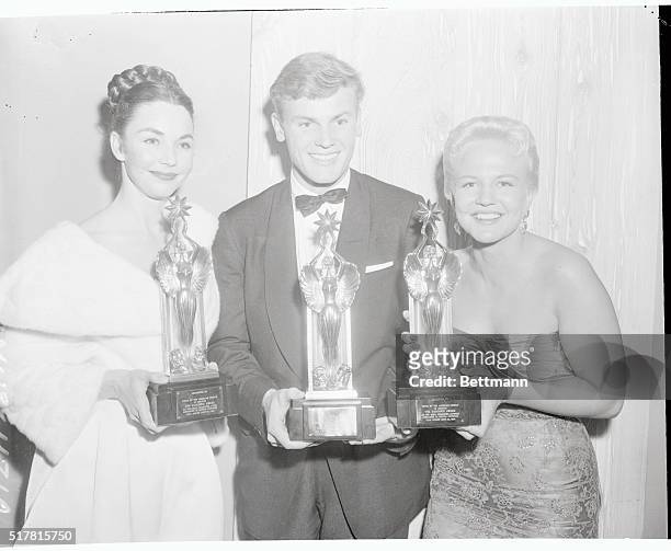 Three winners of the first annual Audience Awards pose with their "Audie" statuettes during ceremonies at the Beverly Hilton Tuesday. Left to right...