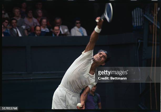 Wimbledon, England: Pancho Gonzales of the U.S. In action during his Wimbledon tennis open match against Ove Bengsson of Sweden. He won this Men's...