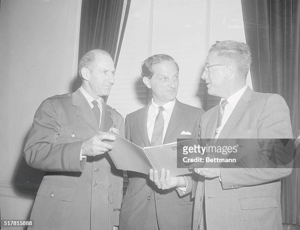 Tell Outer Space Probers of "Eye-in-the-Sky. Washington, D.C.: Brig. Gen. H.A. Boushey, left, deputy director of Air Force research and development;...