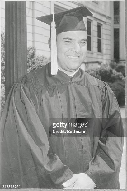 Athens, Georgia: Hamilton Holmes who with Charlayne Hunter, became the first Negroes to attend the University of Georgia in 1961, smiles in cap and...