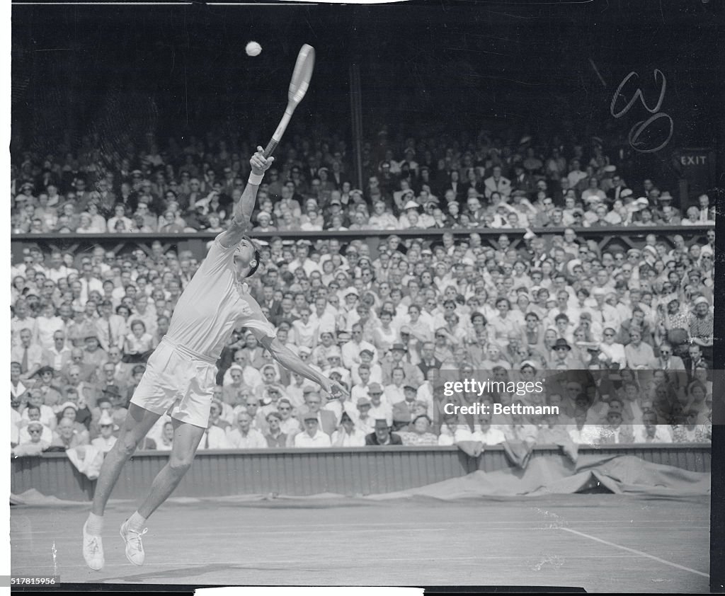 S. Davidson Stretching to Hit Tennis Ball