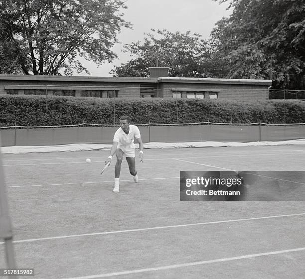 Arthur Ashe playing McKinley in Wimledon Tennis Tournament in England. McKinley won.