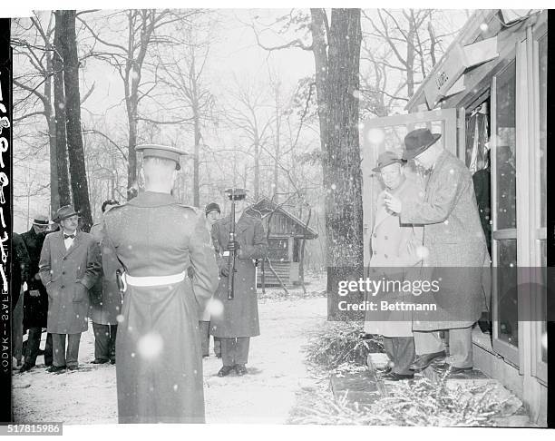 President Eisenhower was greeted by snow as he emerged from today's Cabinet Meeting with White House Staff Secretary, Col. Andrew Goodpaster. The...