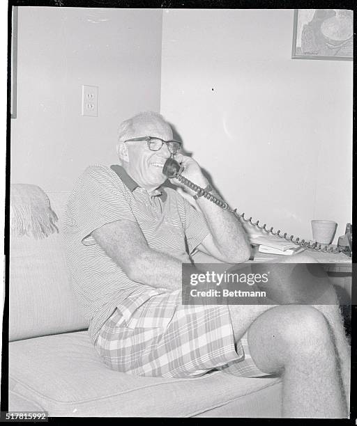 Famed pediatrician Benjamin Spock, wearing casual cloths at this vacation resort 7/11, talks with newsmen over telephone after learning U.S. Court of...