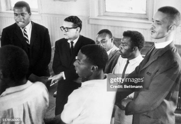 Here civil rights leaders sing a protest song, "We Shall Overcome."