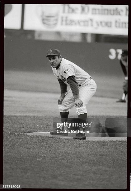 Mets' coach Yogi Berra, full-length coaching at first base during the game against the Pittsburgh Pirates.