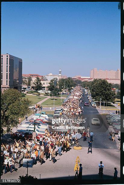 Participants in Moratorium Day rally held at the University of Texas October 15th march to the State Capitol.