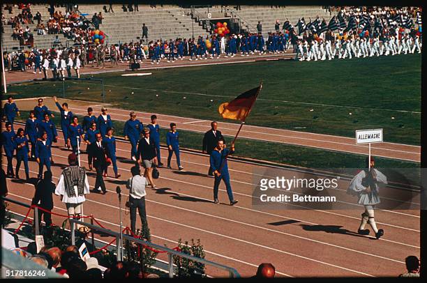 Athens: The West German athletes, due to compete in the European Games, parade at the opening ceremony here. Shortly afterwards, the entire team...