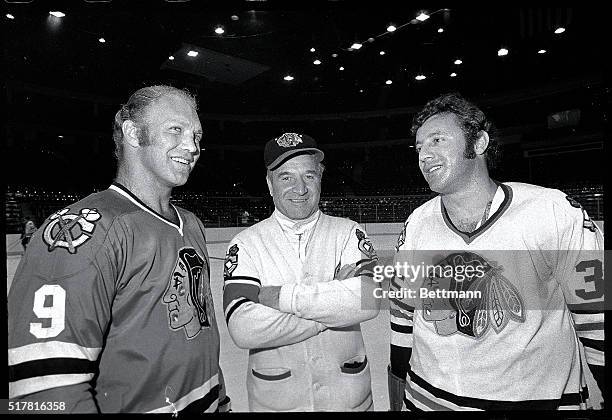 Bobby Hull, coach Billy Reay and goalie Tony Esposito are shown at opening day of training at Chicago Stadium 9/14.