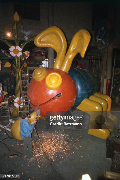 Final welding touch is put on the nose of "Cootie" bug float which will appear in this year's Macy's Thanksgiving Day Parade. Based on the bug in the...
