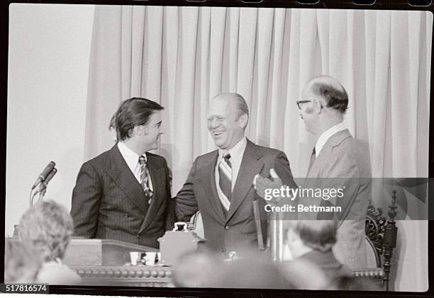 President Ford having survived an assassination attempt is all smiles as California Governor Edmund Brown Jr. And James R. Mills Senate President...