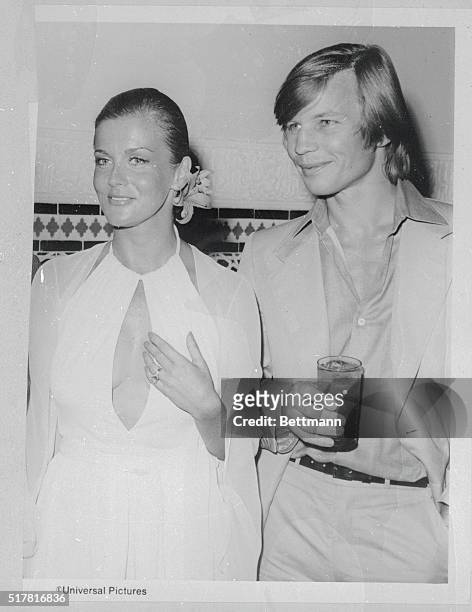 Ann-Margret and actor Michael York are shown at a party tossed by Universal Pictures to launch the spoof of Hollywood's film, The Last Remake of Beau...