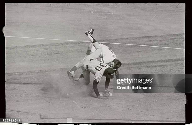 Reds' Pete Rose upsets Yankee second baseman Willie Randolph to break up double play in the sixth inning 10/16.