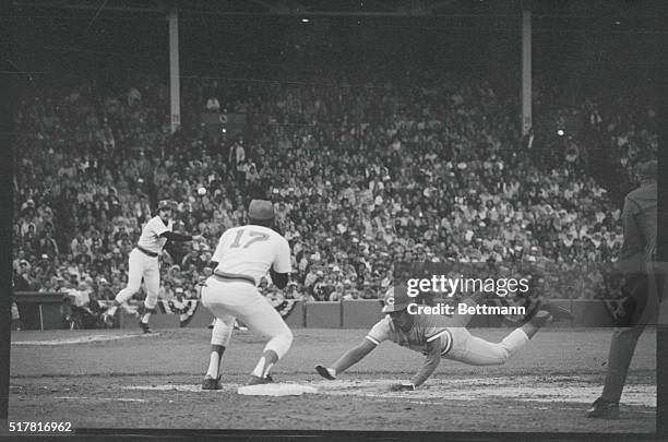 Red Sox pitcher Dick Drago tries picking off Dave Concepcion at first base in ninth inning of the 2nd World Series game as Cecil Cooper covers the...