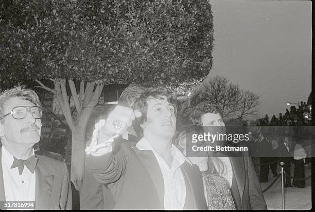 Hollywood: Actor Sylvester Stallone, Best Actor nominee in the 49th Annual Academy Awards presentations, holds up his fist in a symbolic gesture as...