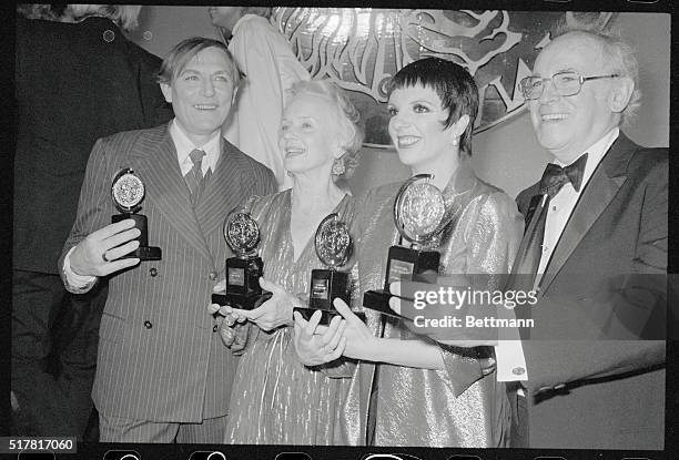 New York: Tony Award winners hold their awards for presentation here. L-R; Bernard Hughes , Liza Minnelli , Jessica Tandy and John Cullum .