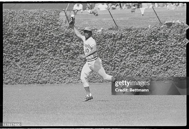 Cincinnati Reds' right fielder Ken Griffey holds the ball in the webbing of his glove, showing all that he had made a safe catch on a ball hit by...