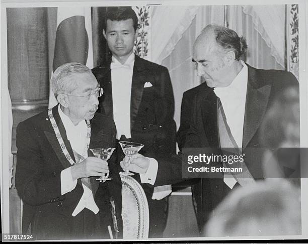 Tokyo, Japan: President Jose Lopez Portillo of Mexico toasts with Emperor Hirohito during a return banquet hosted by Portillo at the guesthouse,...