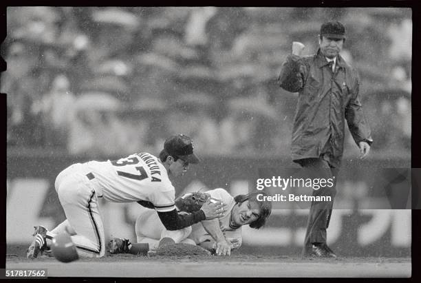 Pete Rose of Cincinnati Reds slides to the 2nd base as Toshic Shinozuka of Yomiuri Giants covers the base when Dan Driessen following Rose makes an...