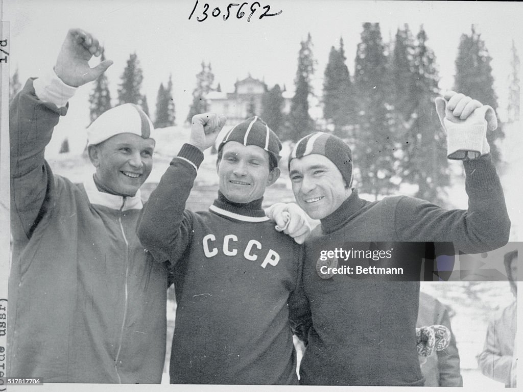 Olympians Raising Their Arms for Camera