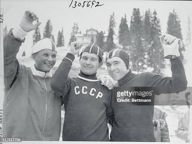 Russia's Mikhailov is shown , with his teammate Grishin, , after they ran a dead heat in the 1,500 meter speed skating event to win another Olympic...