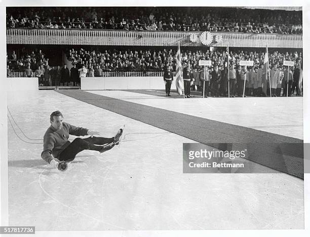Italian speed skating champion Guido Caroli gave the assemblage and himself a bad moment during the Winter Olympic official opening when he fell to...
